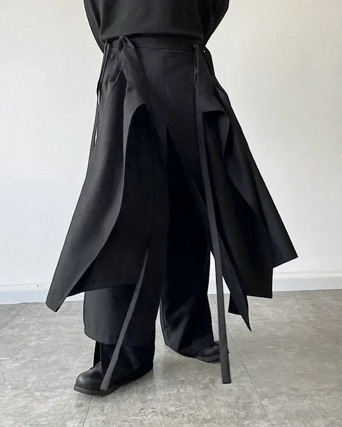 Clotechnow black modular skirted hakama pants featuring a layered hybrid silhouette and wide-leg trouser construction.