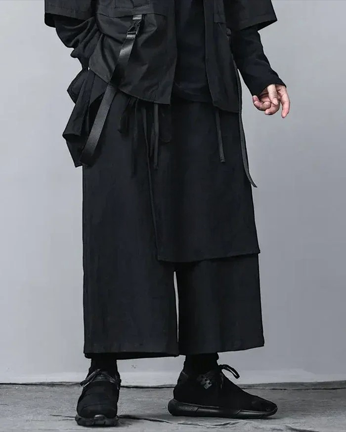 Clotechnow black wide-leg hakama pants featuring deep pleats and a modern layered silhouette with techwear details