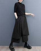 Clotechnow black sculpted hakama pants with a wide-leg draped silhouette and drawstring waist on a model