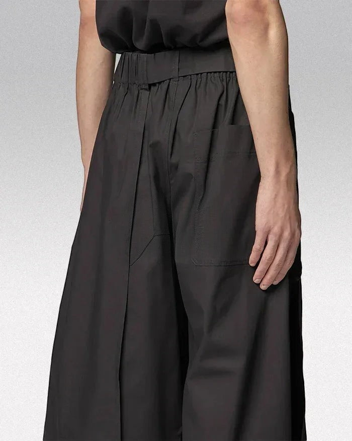 Clotechnow black short-length hakama pants with a wide-leg draped silhouette and elasticated waistband