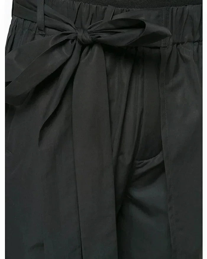 Clotechnow black short-length hakama pants featuring a wide-leg silhouette and an adjustable tie-waist detail.