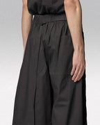 Clotechnow black short-length hakama pants with a wide-leg draped silhouette and elasticated waist