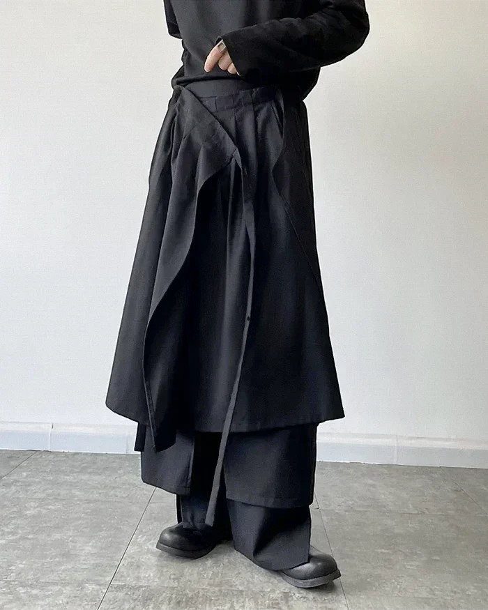 Clotechnow modular black skirted hakama pants with layered fabric construction and wide-leg silhouette.