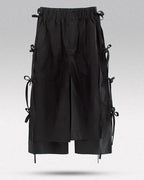 Clotechnow black taper cuff hakama pants featuring a wide-leg draped silhouette and side tie details