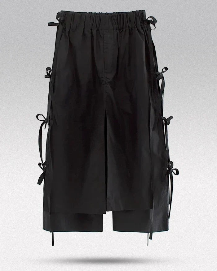 Clotechnow black taper cuff hakama pants featuring a wide-leg draped silhouette and side tie details