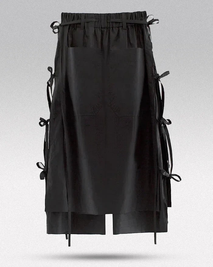 Clotechnow black taper cuff hakama pants featuring a wide-leg silhouette with side ribbon tie details.