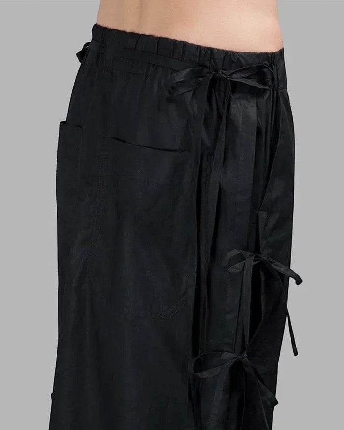 Clotechnow black taper cuff hakama pants with drawstring waist and side tie details in a wide-leg streetwear style