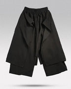 Clotechnow black Tattsuke profile hakama pants with a wide-leg draped silhouette and elastic drawstring waist