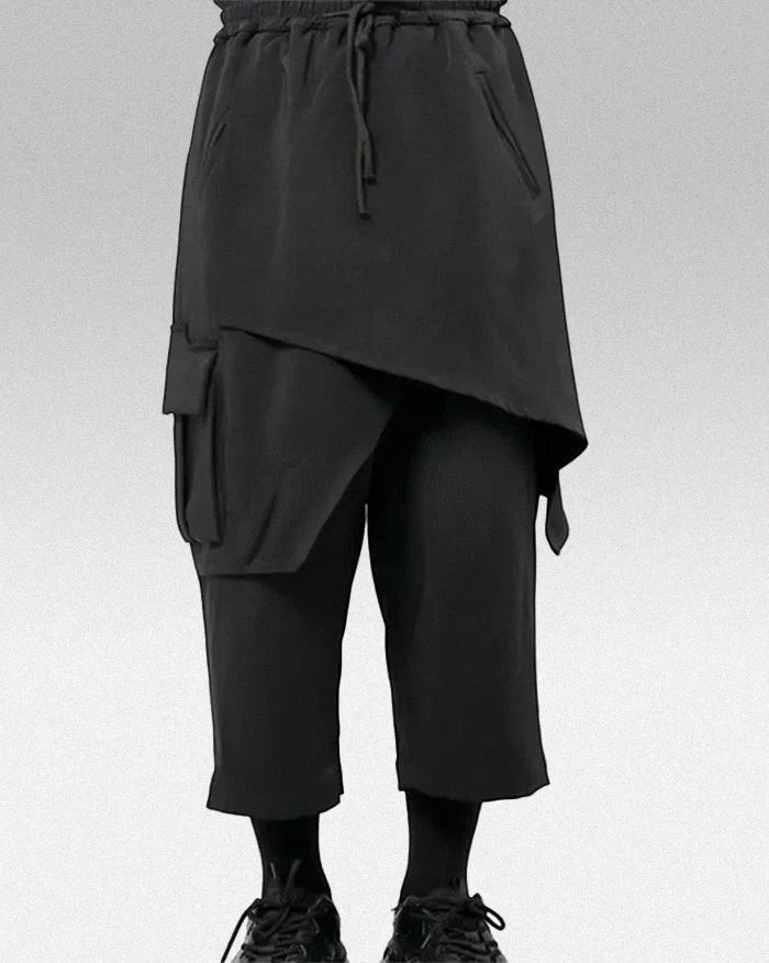 Clotechnow black techwear hakama pants with a wide-leg draped silhouette, drawstring waist, and side cargo pocket.