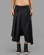 Clotechnow black wide-leg Night Utility Hakama pants with a draped layered design and button closure detail.