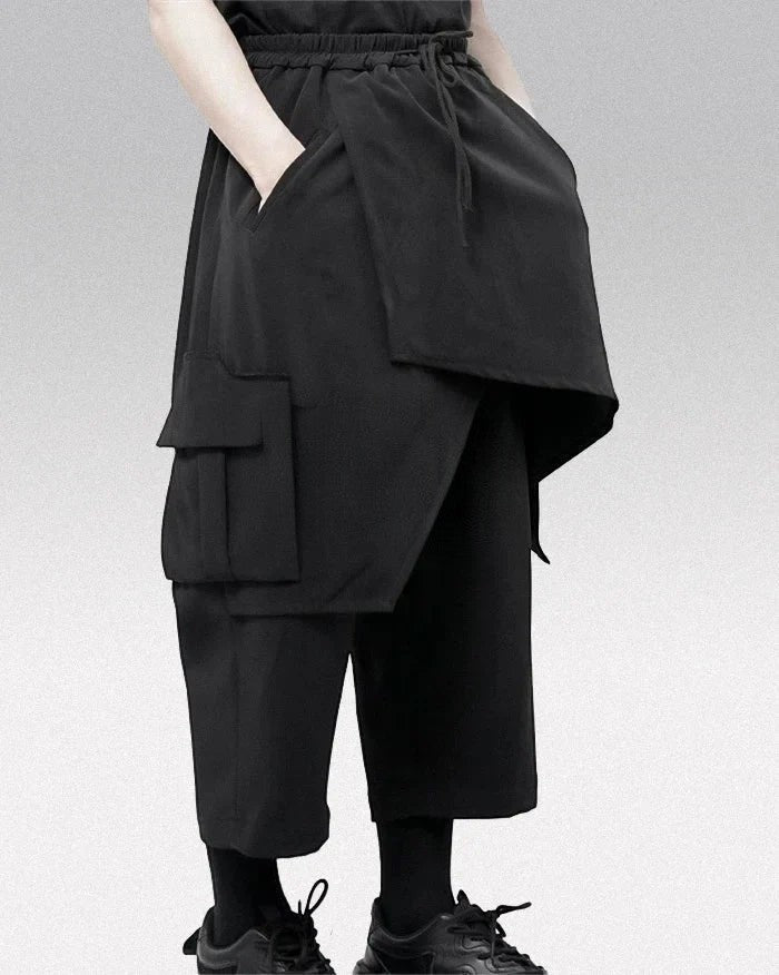 Clotechnow black wide-leg hakama pants with layered draped panels and side cargo pockets for a modern streetwear look