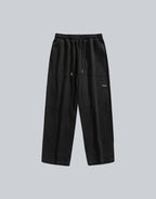 Clotechnow black wide-leg hakama pants with an elastic drawstring waist and minimalist streetwear design.