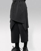 Clotechnow black wide-leg hakama pants with a draped layered design and drawstring waist for a modern streetwear look.