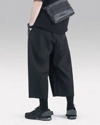 Clotechnow Ninja Motion black wide-leg hakama pants worn with a crossbody bag and sneakers in a streetwear style