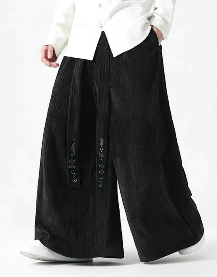 Clotechnow black wide-leg Harajuku hakama pants with vertical texture and draped silhouette on a model