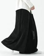 Clotechnow black Harajuku volume hakama pants with a wide-leg pleated silhouette and draped streetwear aesthetic.