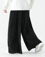 Clotechnow Harajuku volume hakama pants in black featuring a wide-leg draped silhouette and textured fabric.