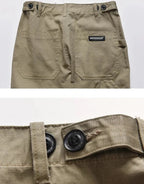 Clotechnow brown multi-utility hakama pants featuring large back pockets, button waist adjusters, and durable fabric.