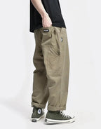 Clotechnow brown multi-utility hakama pants with a wide-leg silhouette and side pockets worn with high-top sneakers