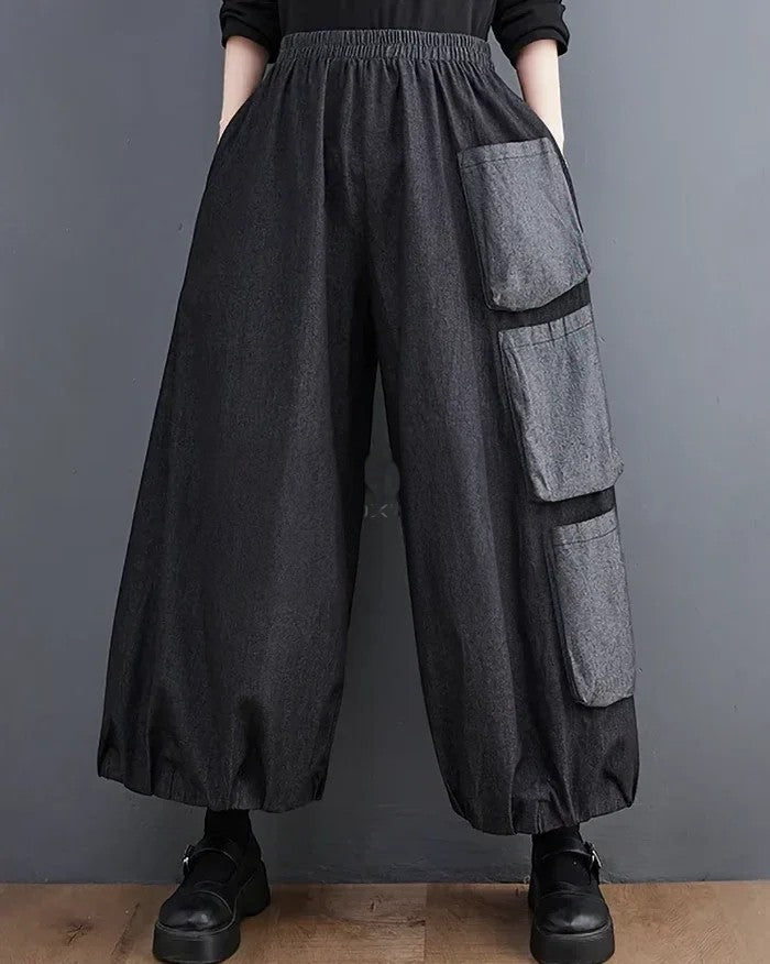 Clotechnow Modern Muse wide-leg hakama pants in charcoal grey with layered cargo pockets and an elasticated waist.