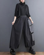 Clotechnow Modern Muse wide-leg hakama pants in charcoal grey with side cargo pockets worn with a black turtleneck