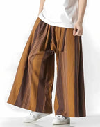Clotechnow earth tone striped hakama pants with a wide-leg draped silhouette worn with a white t-shirt