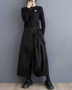 Clotechnow Eclipse Silhouette Hakama pants in black with a wide-leg draped fit and side tie detail on a model
