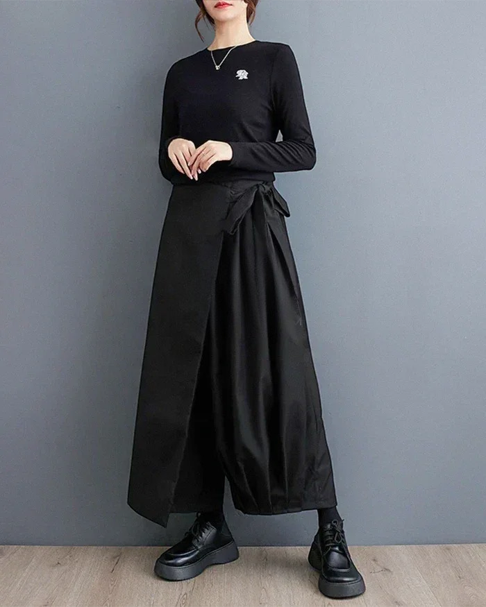 Clotechnow Eclipse Silhouette Hakama Pants in black with a wide-leg draped fit and wrap-around waist tie detail.
