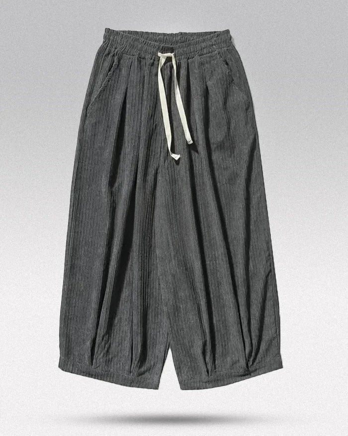 Clotechnow gray wide-leg hakama pants with a textured fabric, elastic drawstring waist, and relaxed draped fit.