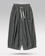 Clotechnow gray wide-leg hakama pants with a textured fabric, elastic drawstring waist, and relaxed draped fit.