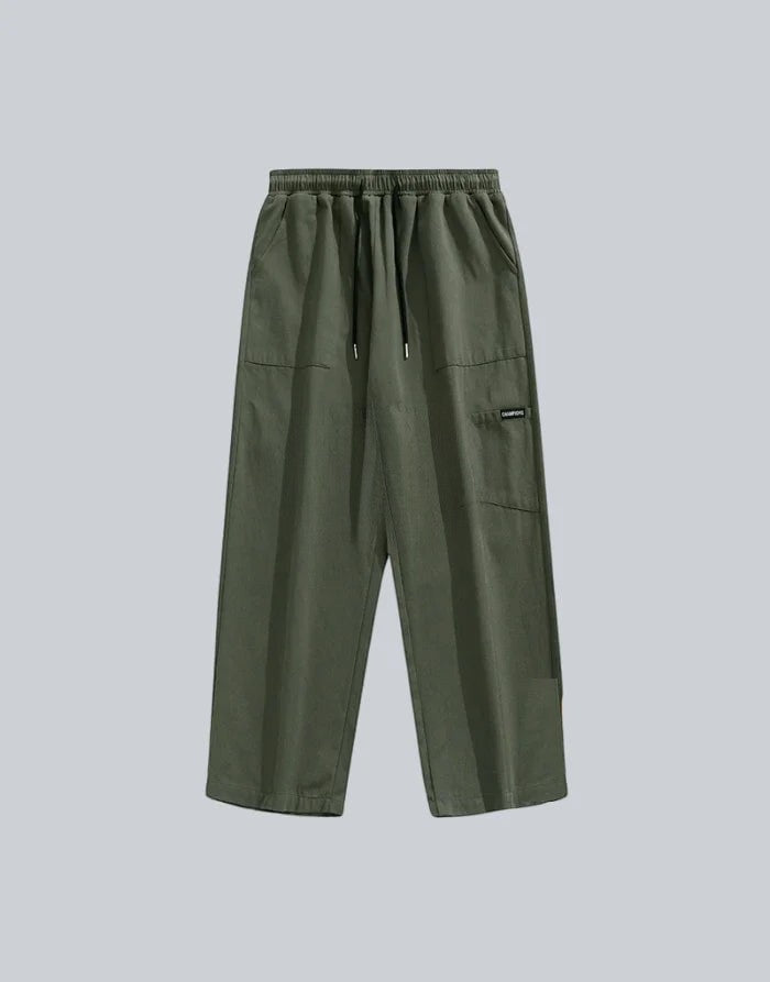 Clotechnow green wide-leg hakama pants with an elastic waistband, drawstring, and side pocket detail.