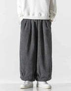 Clotechnow charcoal grey corduroy hakama pants with a wide-leg draped silhouette and pleated waist detail.