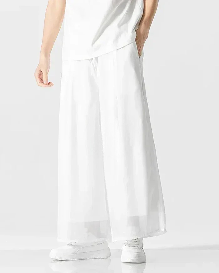 Clotechnow Ivory Flow Hakama Pants in white with a wide-leg draped silhouette worn by a model