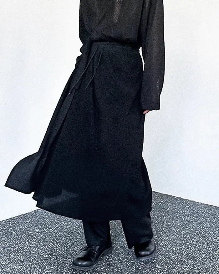 Clotechnow Kuro Frame black wide-leg hakama pants with a draped silhouette worn with a matching top and boots
