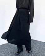 Clotechnow Kuro Frame black wide-leg hakama pants with a draped silhouette worn with a matching top and boots