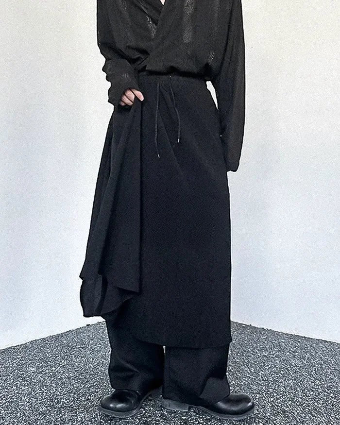Clotechnow Kuro Frame black hakama pants with a wide-leg draped silhouette and drawstring waist in a streetwear style.