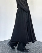 Clotechnow Kuro Frame black wide-leg hakama pants with a draped silhouette worn with black boots
