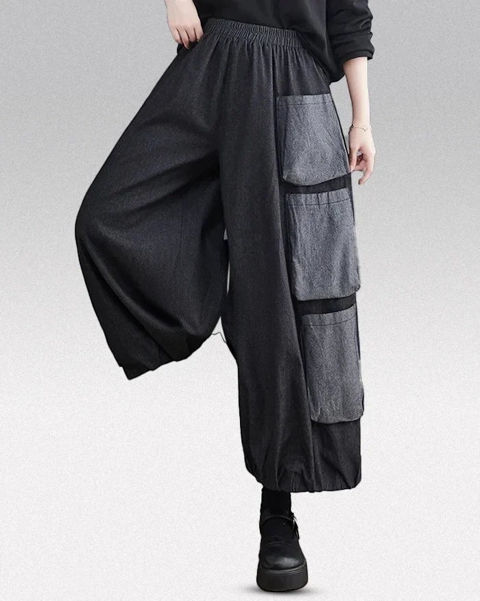 Clotechnow Modern Muse wide-leg hakama pants in charcoal grey with layered cargo pockets and an elasticated waist.