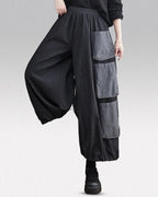 Clotechnow Modern Muse wide-leg hakama pants in charcoal grey with layered cargo pockets and an elasticated waist.