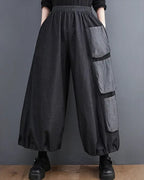 Clotechnow Modern Muse Hakama pants in charcoal grey with a wide-leg silhouette, elastic waist, and cargo pockets.