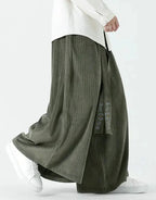 Clotechnow Harajuku volume hakama pants in olive green with a wide-leg draped silhouette and textured fabric detail.