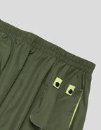 Clotechnow Forest Tone Hakama Pants in olive green with lime green accents, featuring a wide-leg fit and cargo pocket