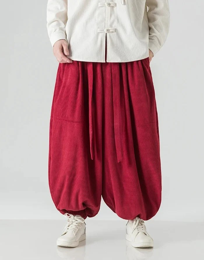 Clotechnow red corduroy hakama pants with a wide-leg draped silhouette and ribbon tie waist detail