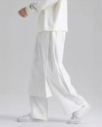 Clotechnow white lightweight drape hakama pants with a wide-leg silhouette worn by a model in a studio setting