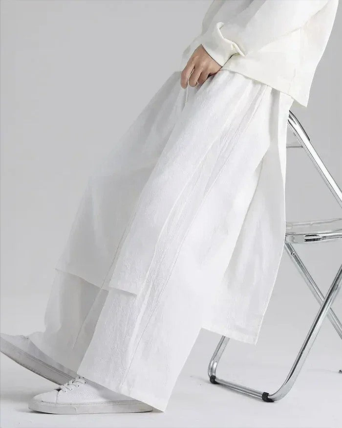 Clotechnow white lightweight drape hakama pants with a wide-leg silhouette worn by a person sitting on a chair