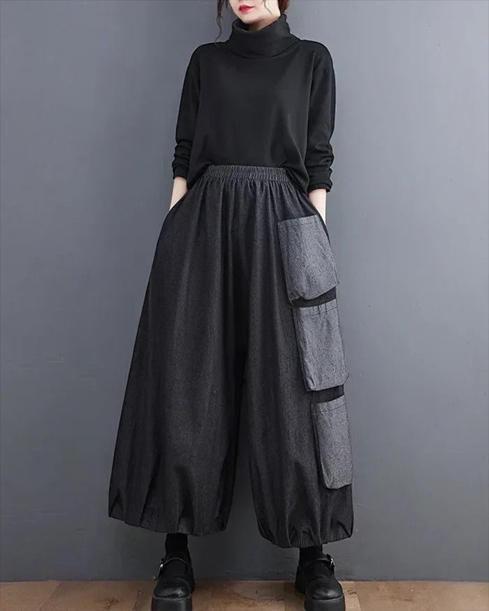 Clotechnow Modern Muse wide-leg hakama pants in charcoal grey with layered cargo pockets and an elasticated waist.