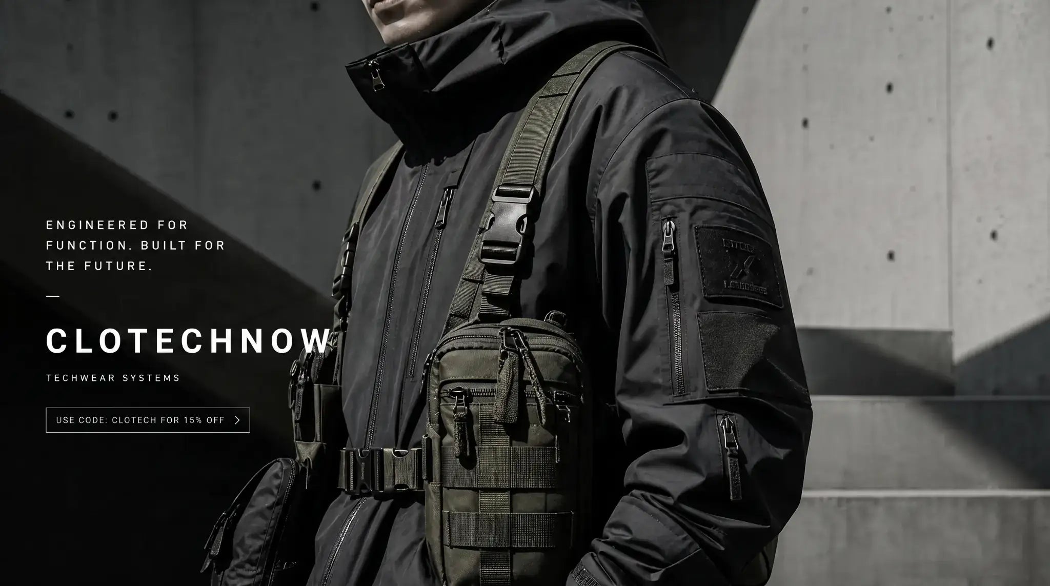 Model wearing tactical techwear clothing in a futuristic, neon-lit urban alleyway - Clotechnow hero banner