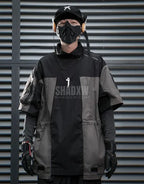 Black and gray techwear t-shirt with geometric color blocking and visual pocket accents creating an elongated avant-garde silhouette — view 3