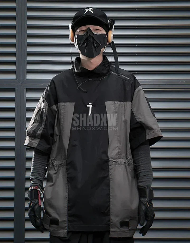 Black and gray techwear t-shirt with geometric color blocking and visual pocket accents creating an elongated avant-garde silhouette — view 3