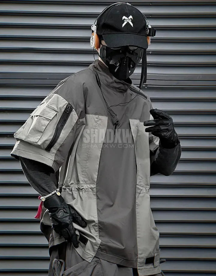 Black and gray techwear t-shirt with geometric color blocking and visual pocket accents creating an elongated avant-garde silhouette — view 5